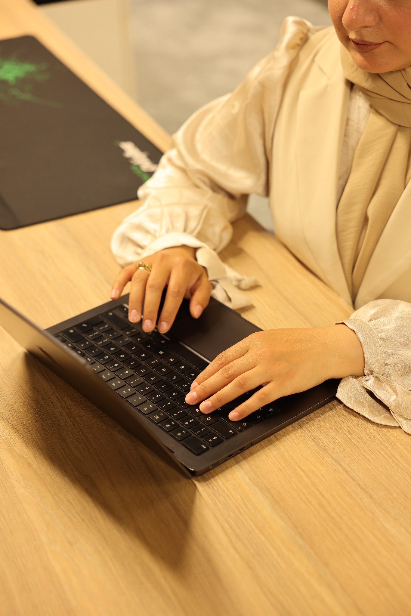 Amira working at her laptop